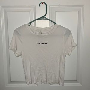 White t-shirt, kinda cropped, kinda see through